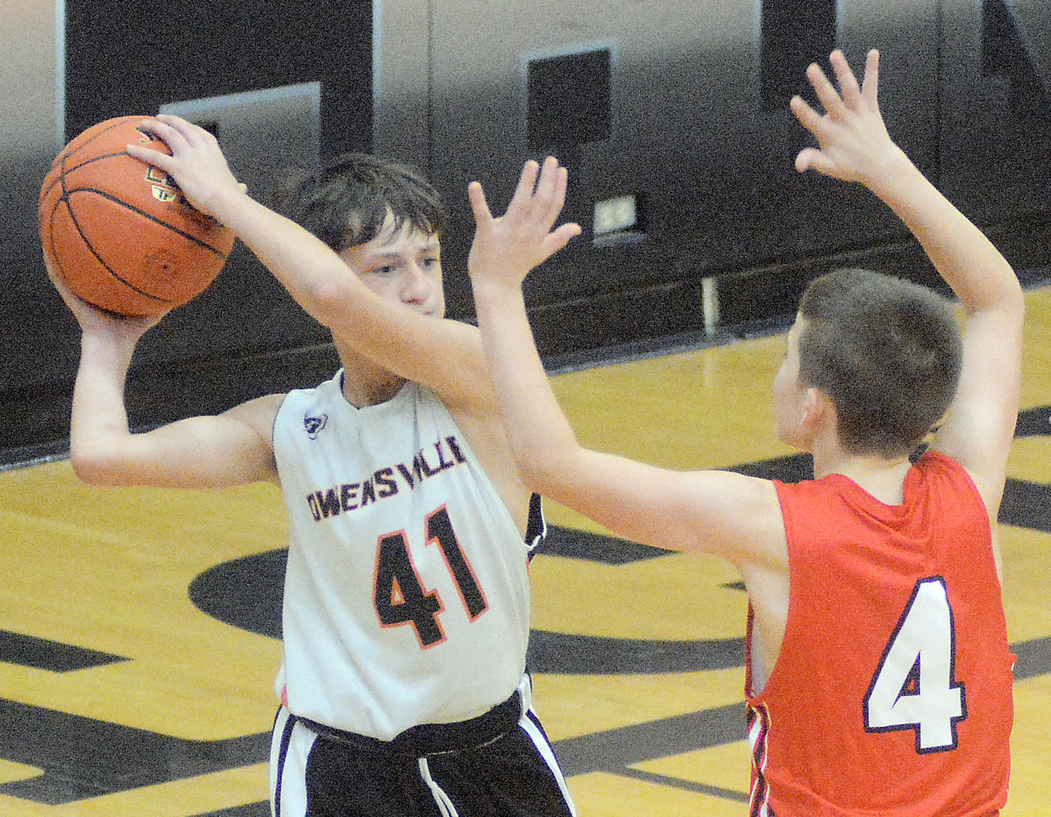 Jax johnston (far left) looks to pass the ball towards the front court for Owensville’s seventh-grade Dutchmen during home basketball action last Wednesday at Owensville High School.